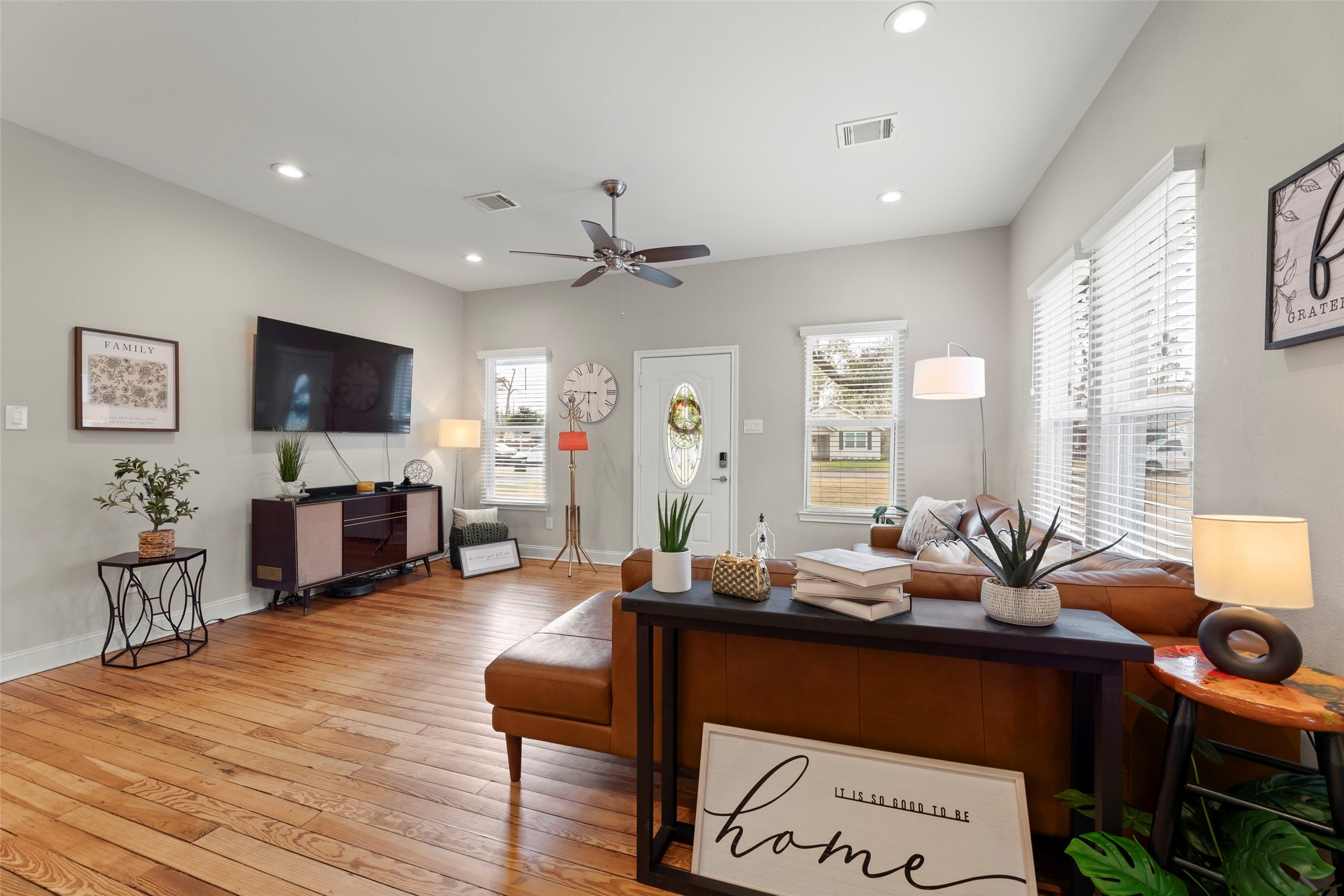 711 4th Street Sealy, TX 77474 - Photo 9 of 37 a living room with furniture and a flat screen tv
