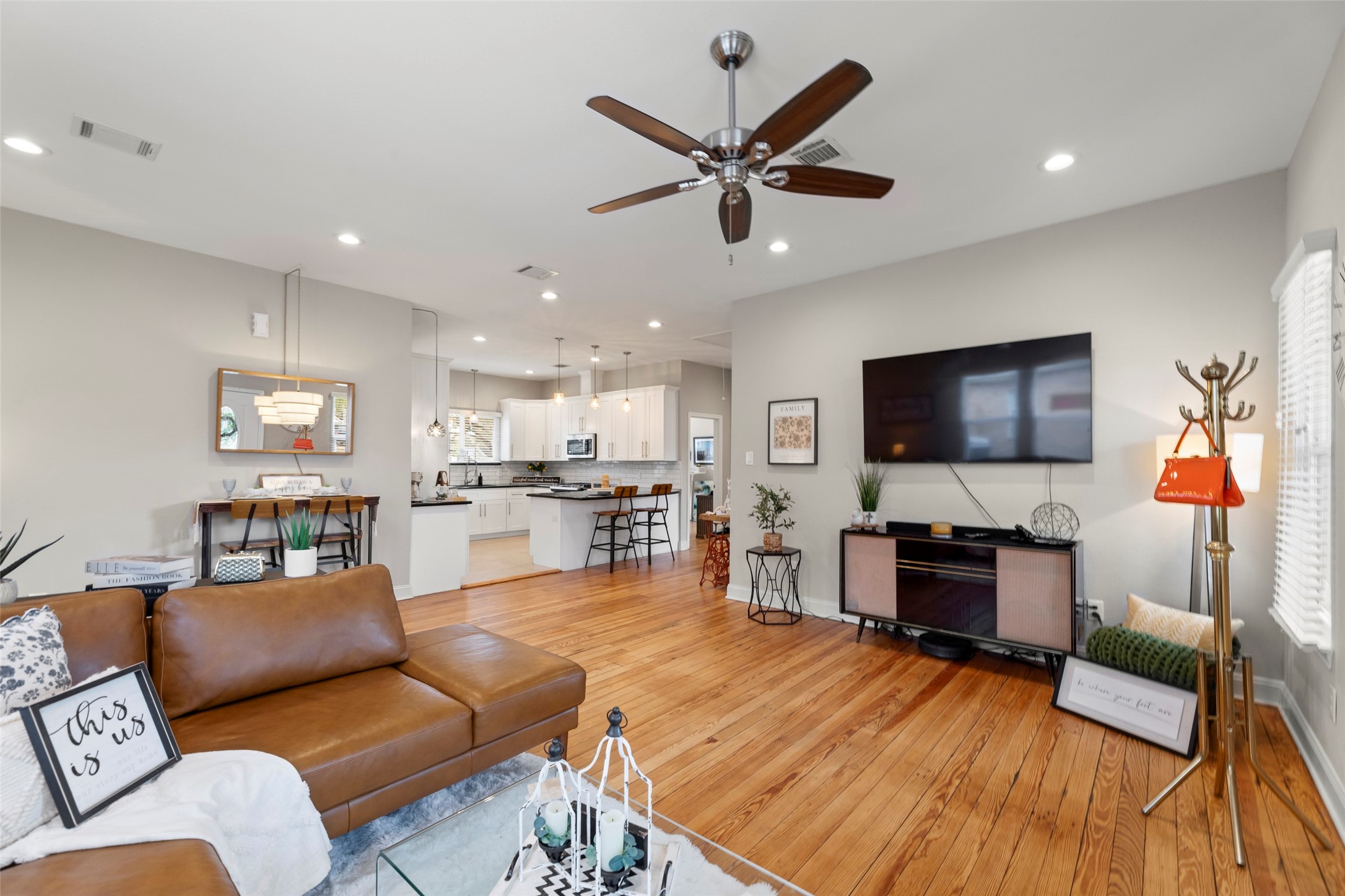 711 4th Street Sealy, TX 77474 - Photo 37 of 37 a living room with furniture and a flat screen tv