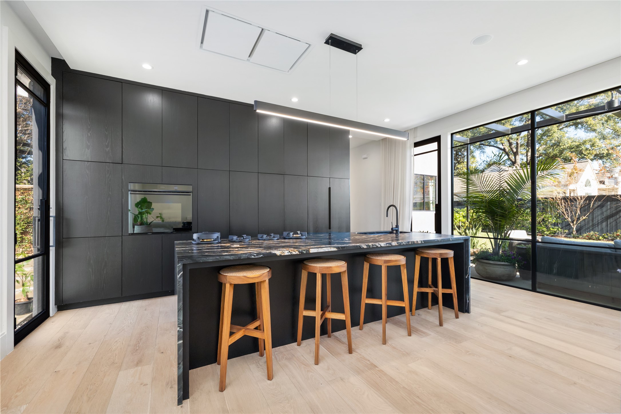 419 West 30th Street Houston, TX 77018 - Photo 14 of 45 a kitchen with a table chairs and wooden floor