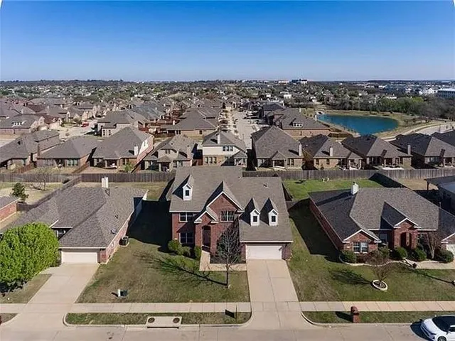 an aerial view of a house with a garden