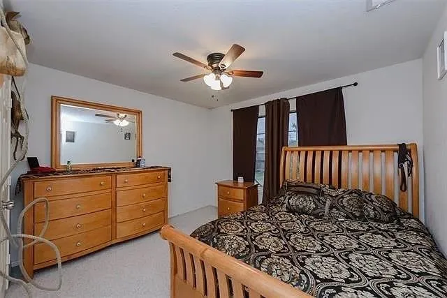 a room that has a mirror and a wooden floor