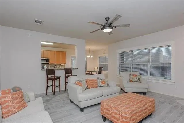 a living room with furniture and a window