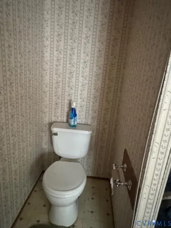 a bathroom with a toilet and a sink