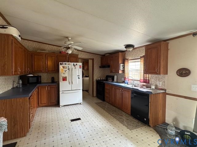 21663 Storys Station Road Franklin, VA 23851 - Photo 3 of 22 a kitchen with granite countertop a sink stove and refrigerator