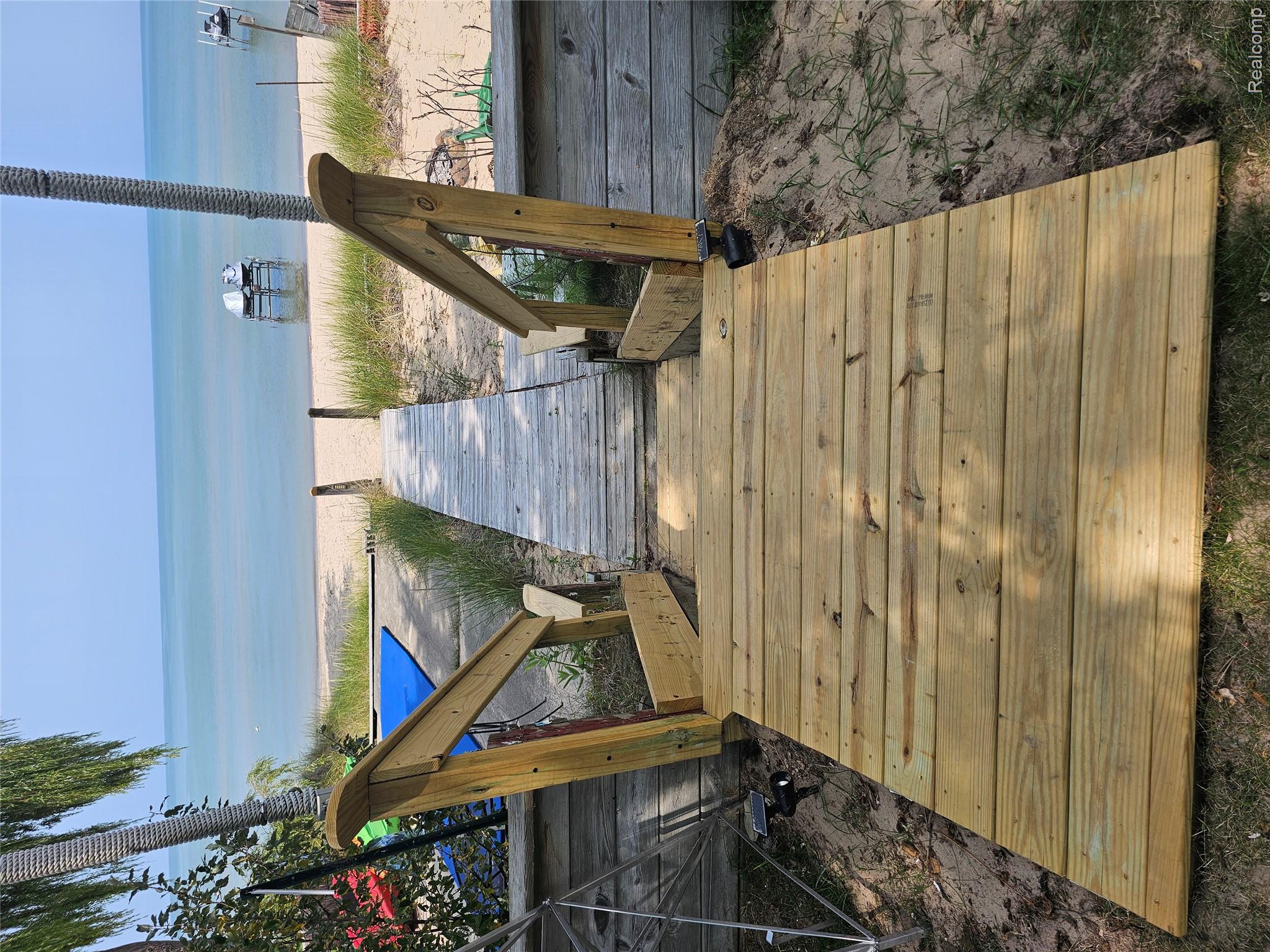 4682 Port Austin Road Caseville, MI 48725 - Photo 12 of 21 Deck with view of water and beach