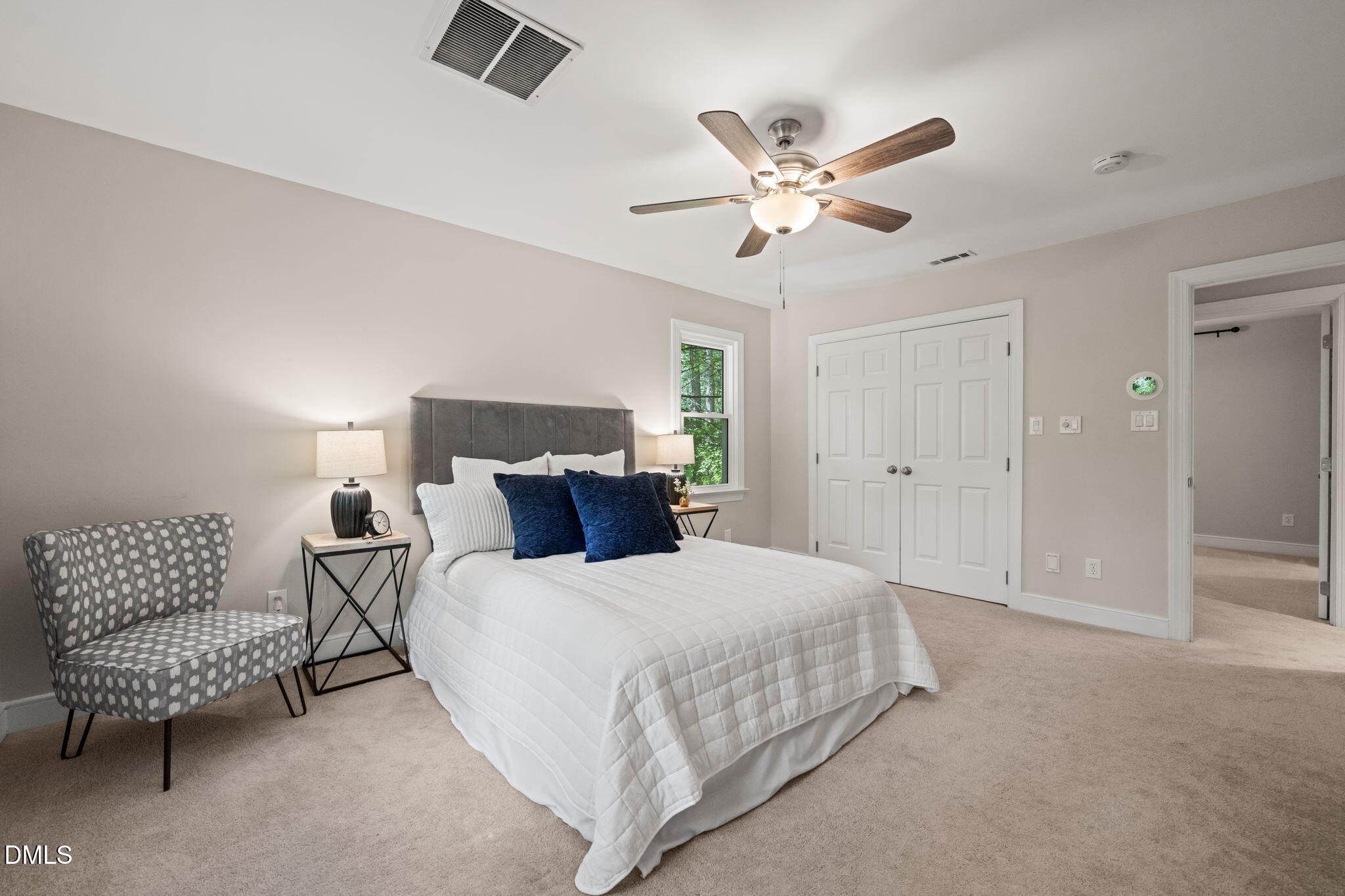18 Strawberry Ridge Lane Durham, NC 27713 - Photo 28 of 59 a bedroom with a bed and a chandelier