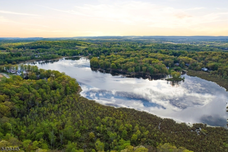 4 Windemere Way Sparta, NJ 07871 - Photo 43 of 50 a view of a lake with mountains in the background
