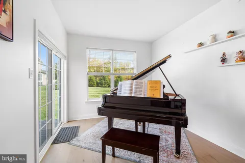 a reading room with furniture and a window
