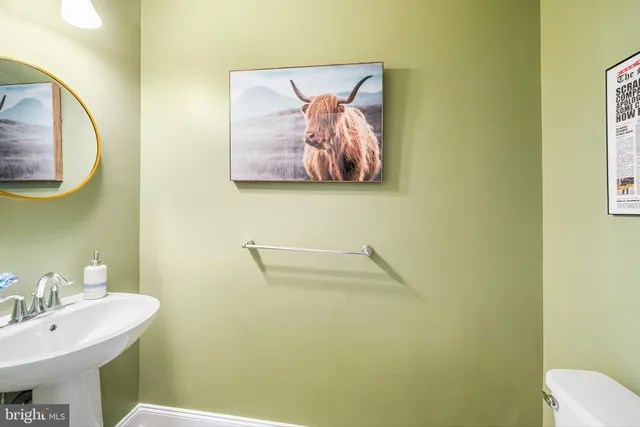 a bathroom with a toilet and a sink