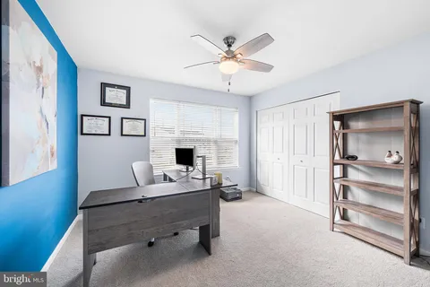 a workspace with furniture and window