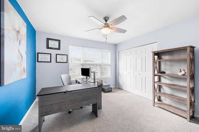 a workspace with furniture and window