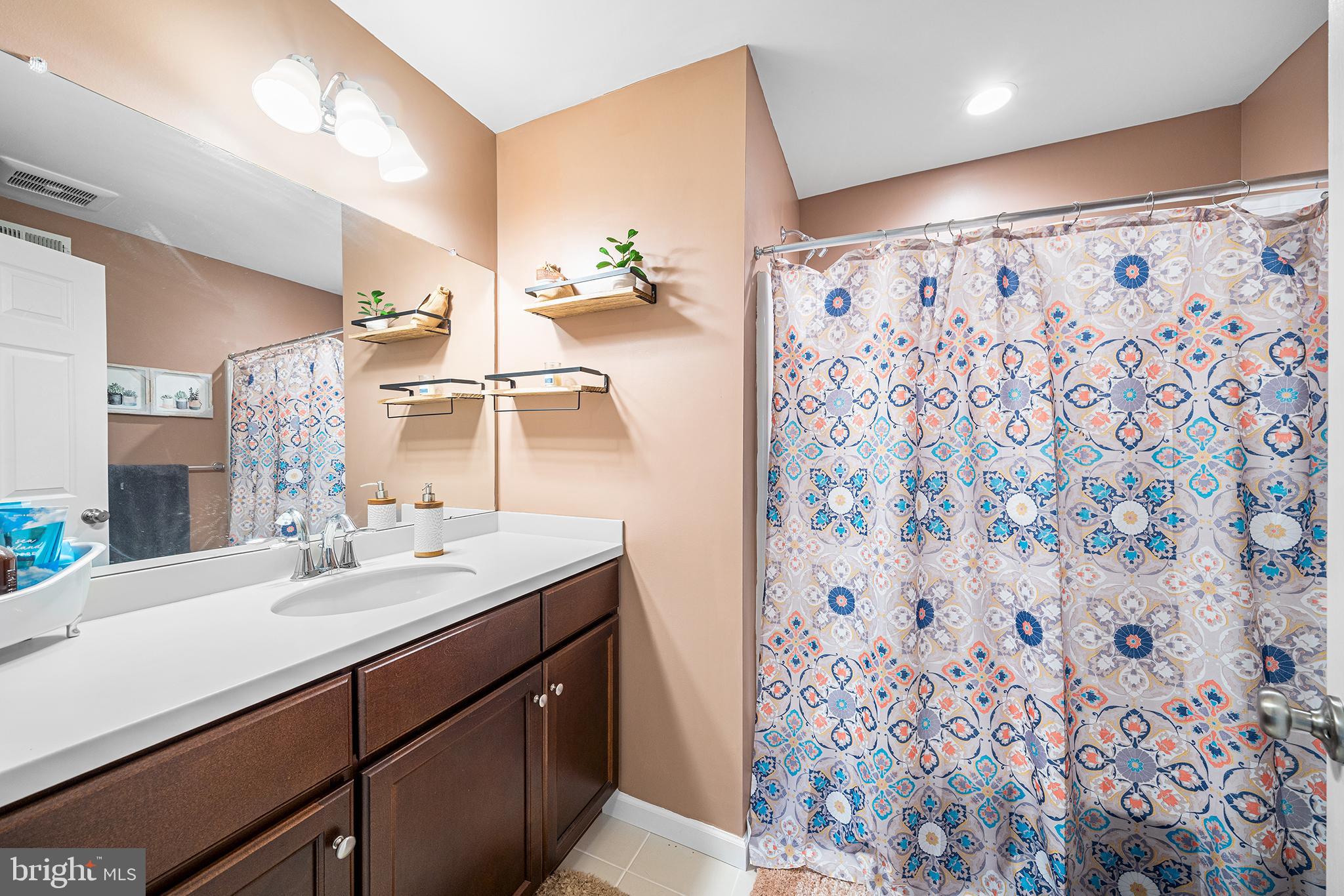 186 Spring Lane Royersford, PA 19468 - Photo 22 of 29 a bathroom with a sink and a mirror