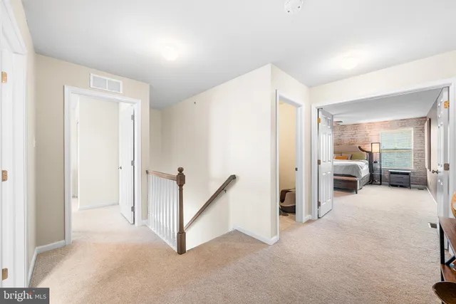 a view of a livingroom with a furniture and windows