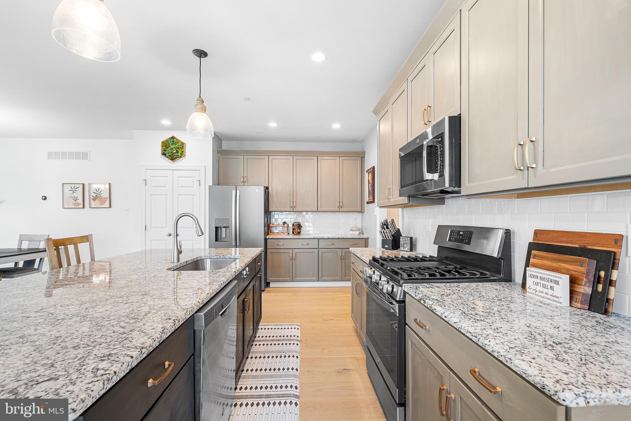 186 Spring Lane Royersford, PA 19468 - Photo 6 of 29 a kitchen with stainless steel appliances granite countertop a sink a stove and a wooden cabinets