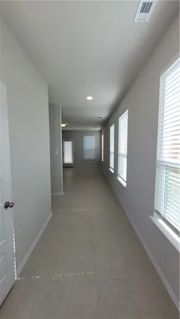 a view of empty room with windows