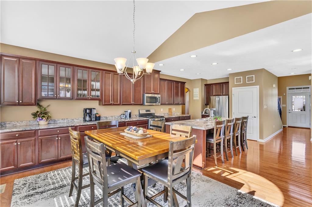7787 Dominick Drive Irwin, PA 15642 - Photo 11 of 35 a view of a dining room with furniture and wooden floor