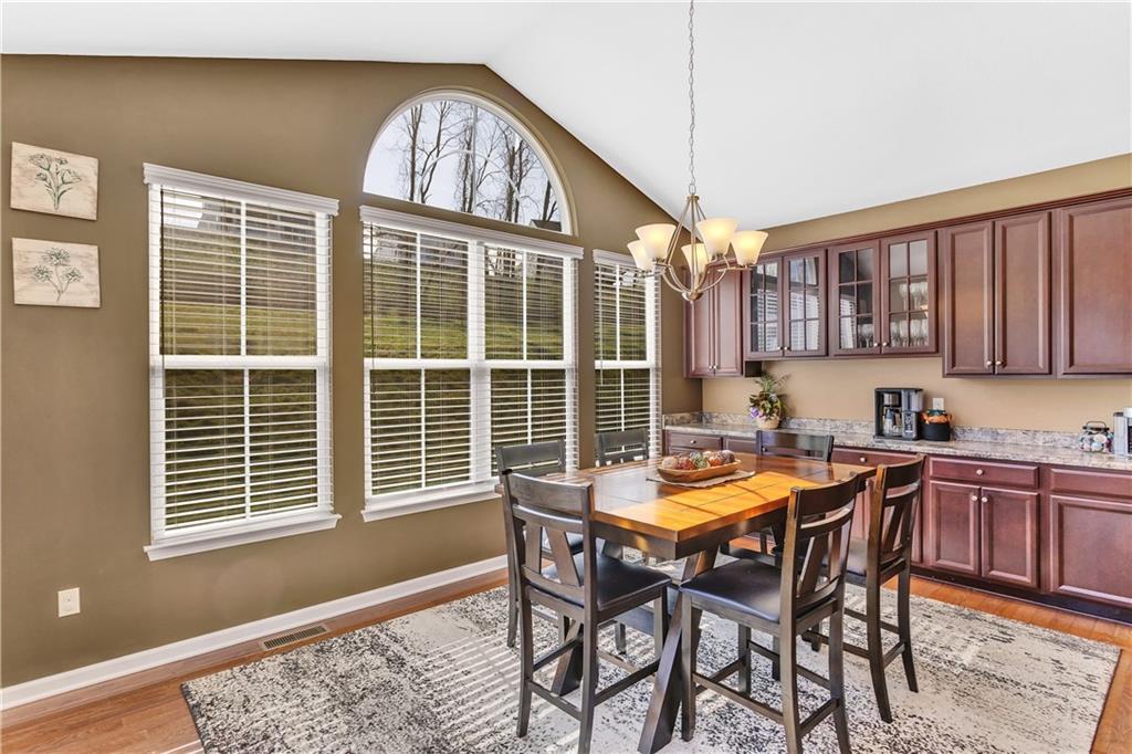 7787 Dominick Drive Irwin, PA 15642 - Photo 14 of 35 a view of a dining room with furniture window and wooden floor
