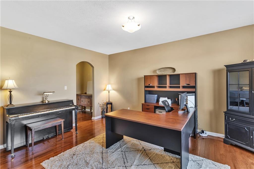 7787 Dominick Drive Irwin, PA 15642 - Photo 17 of 35 a bedroom with a bed and a table in it