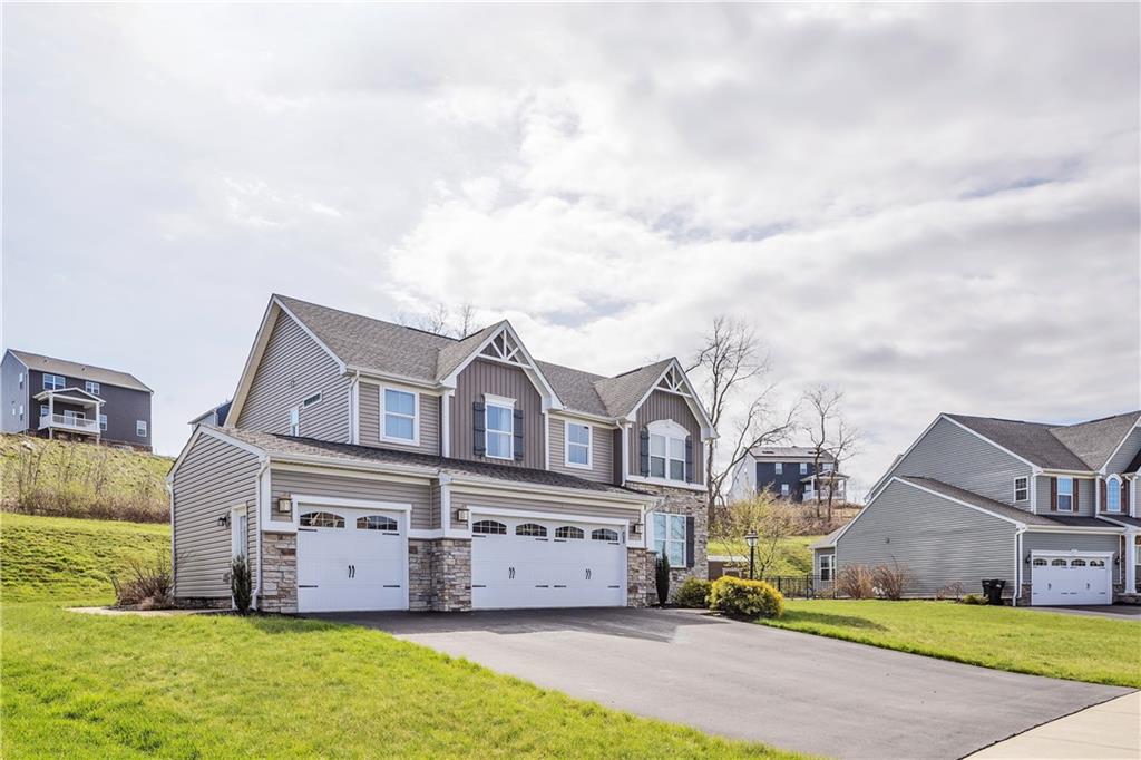 7787 Dominick Drive Irwin, PA 15642 - Photo 2 of 35 a view of a house with a big yard and large trees