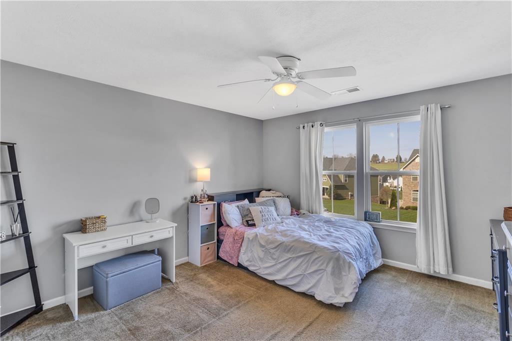 7787 Dominick Drive Irwin, PA 15642 - Photo 27 of 35 a bedroom with a bed and a window
