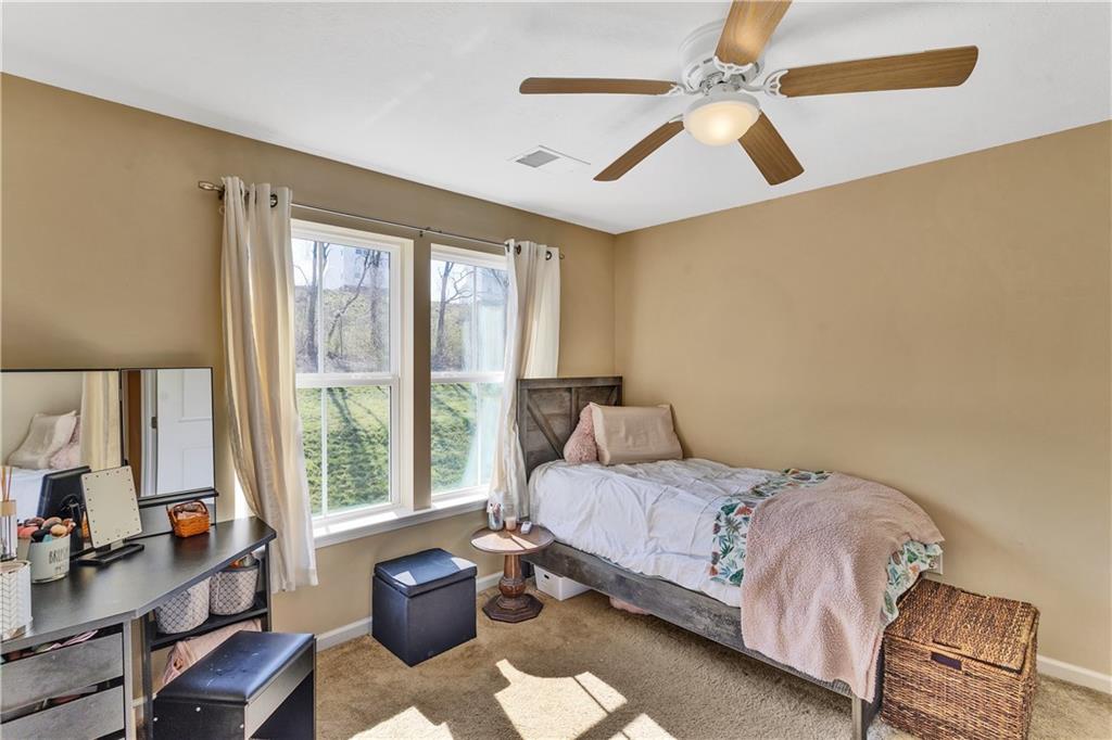 7787 Dominick Drive Irwin, PA 15642 - Photo 28 of 35 a bedroom with a bed and a chandelier