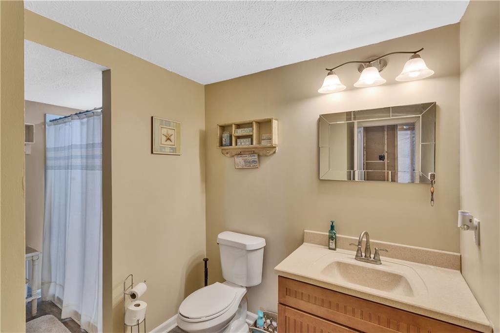 7787 Dominick Drive Irwin, PA 15642 - Photo 31 of 35 a bathroom with a sink mirror and toilet