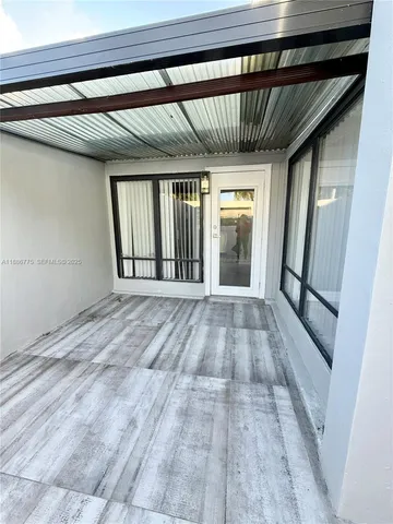 a view of entryway with wooden floor