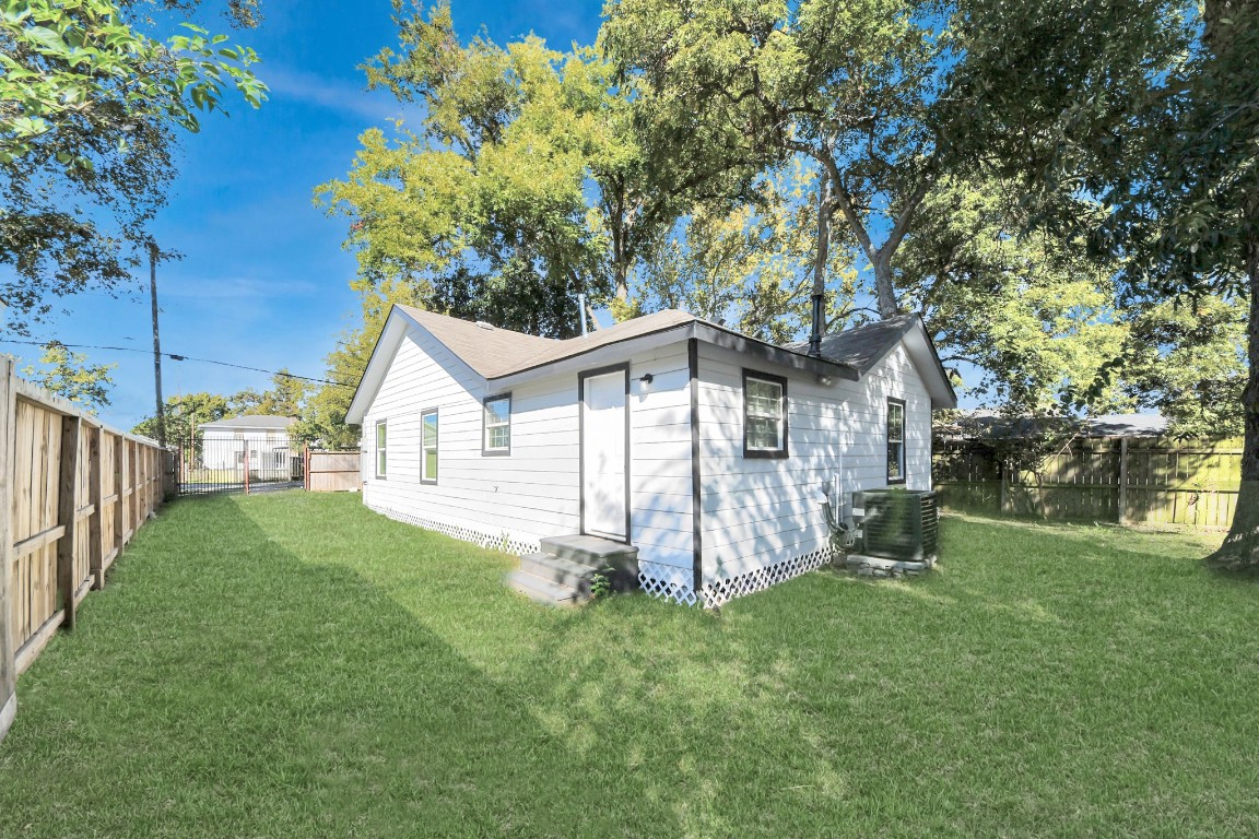 3206 Melbourne Street Houston, TX 77026 - Photo 12 of 41 a front view of a house with a yard and porch