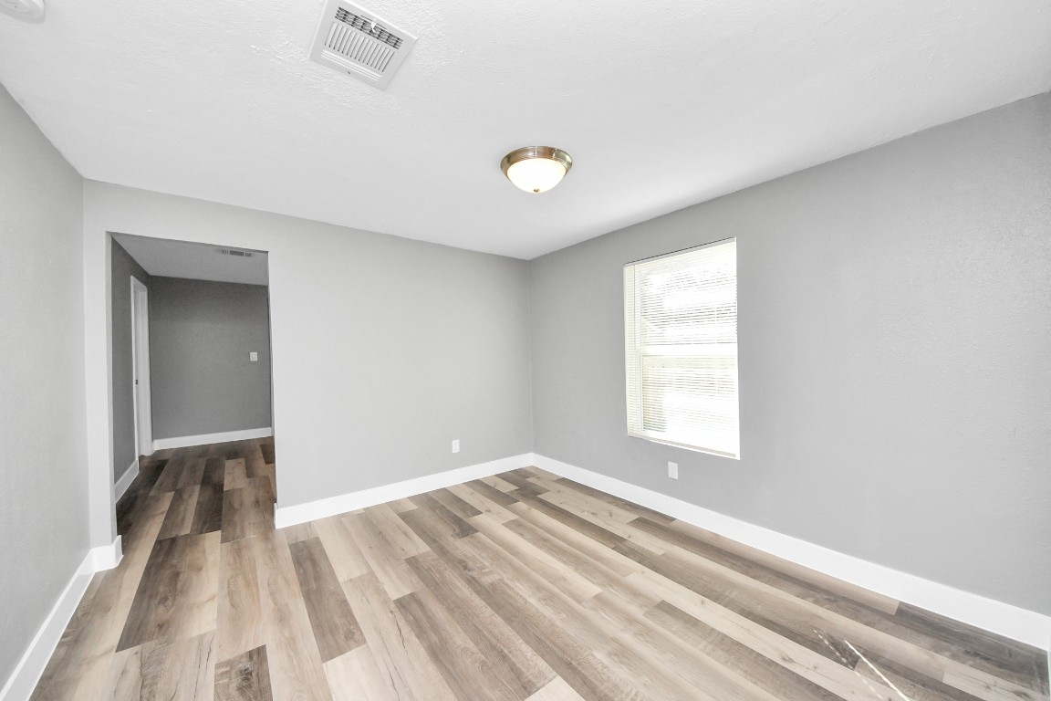 3206 Melbourne Street Houston, TX 77026 - Photo 20 of 41 a view of room with window and ceiling fan