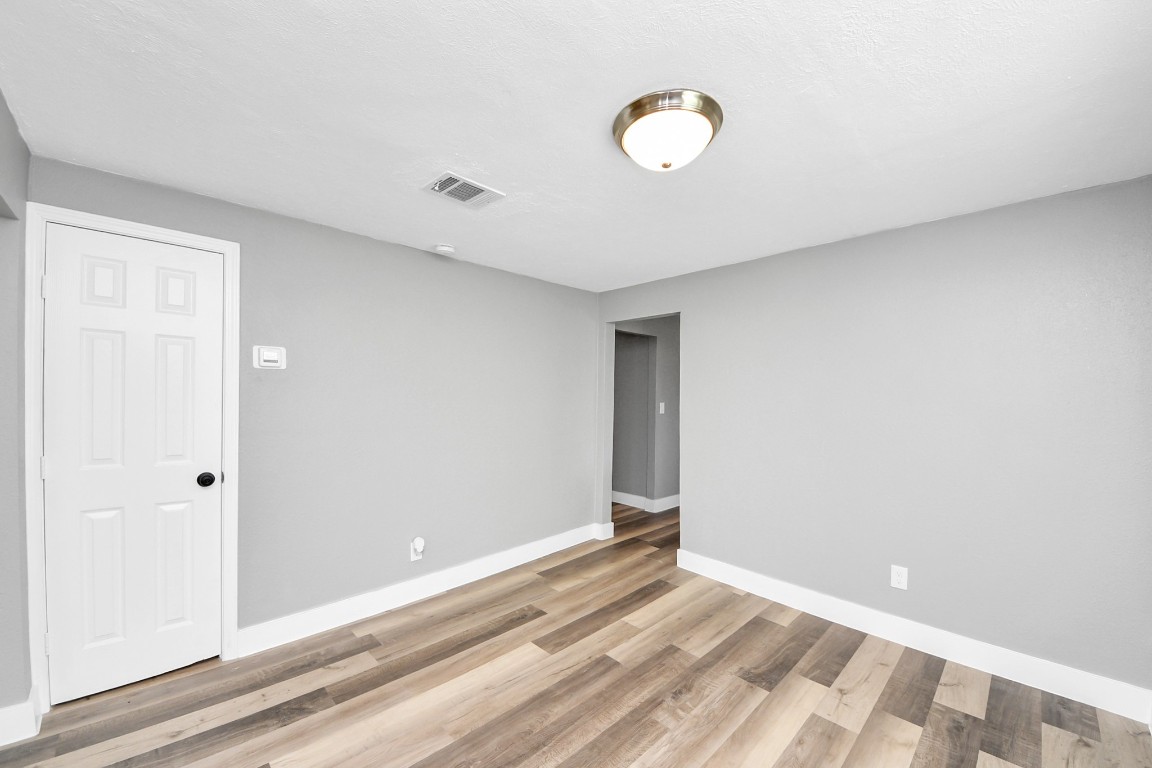 3206 Melbourne Street Houston, TX 77026 - Photo 22 of 41 a view of a livingroom with wooden floor