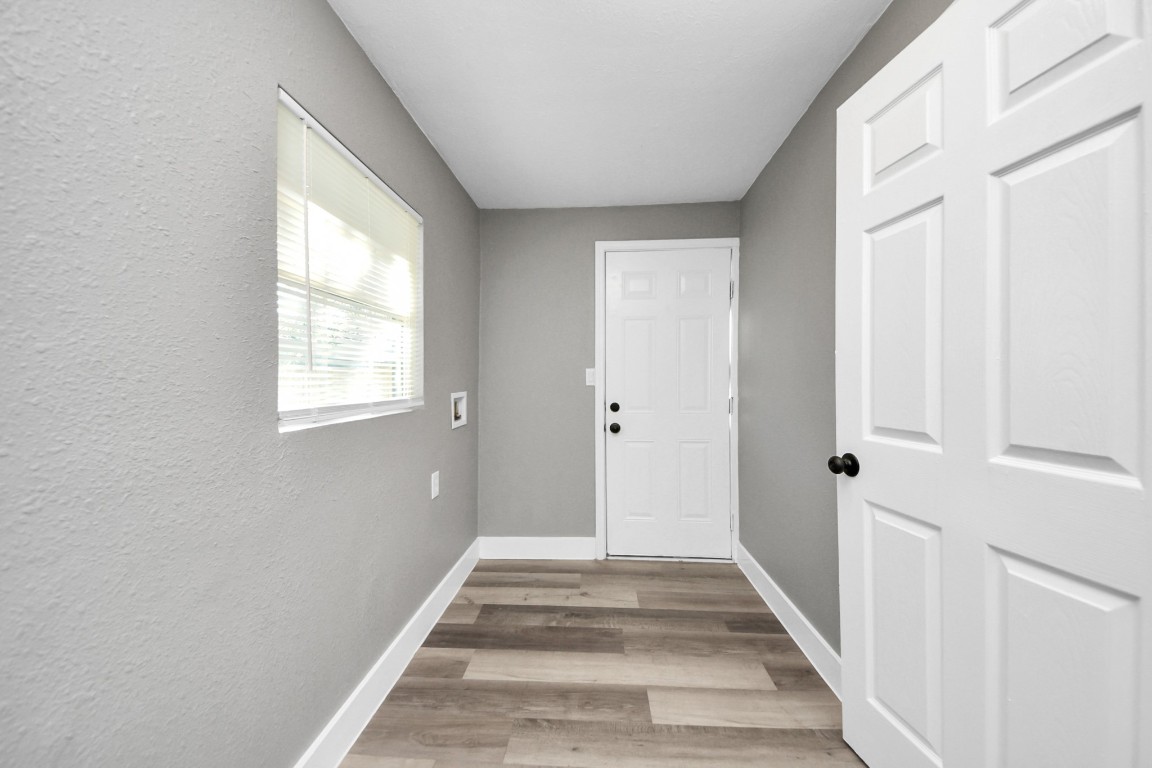3206 Melbourne Street Houston, TX 77026 - Photo 31 of 41 a view of a hallway with wooden floor and closet