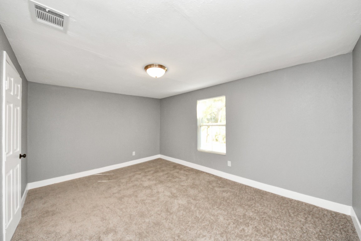 3206 Melbourne Street Houston, TX 77026 - Photo 32 of 41 a view of an empty room with a window