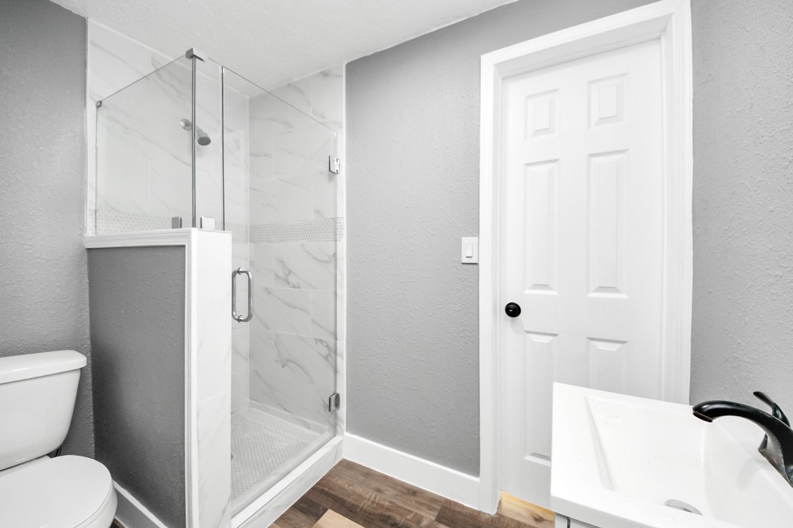 3206 Melbourne Street Houston, TX 77026 - Photo 39 of 41 a bathroom with a shower and toilet