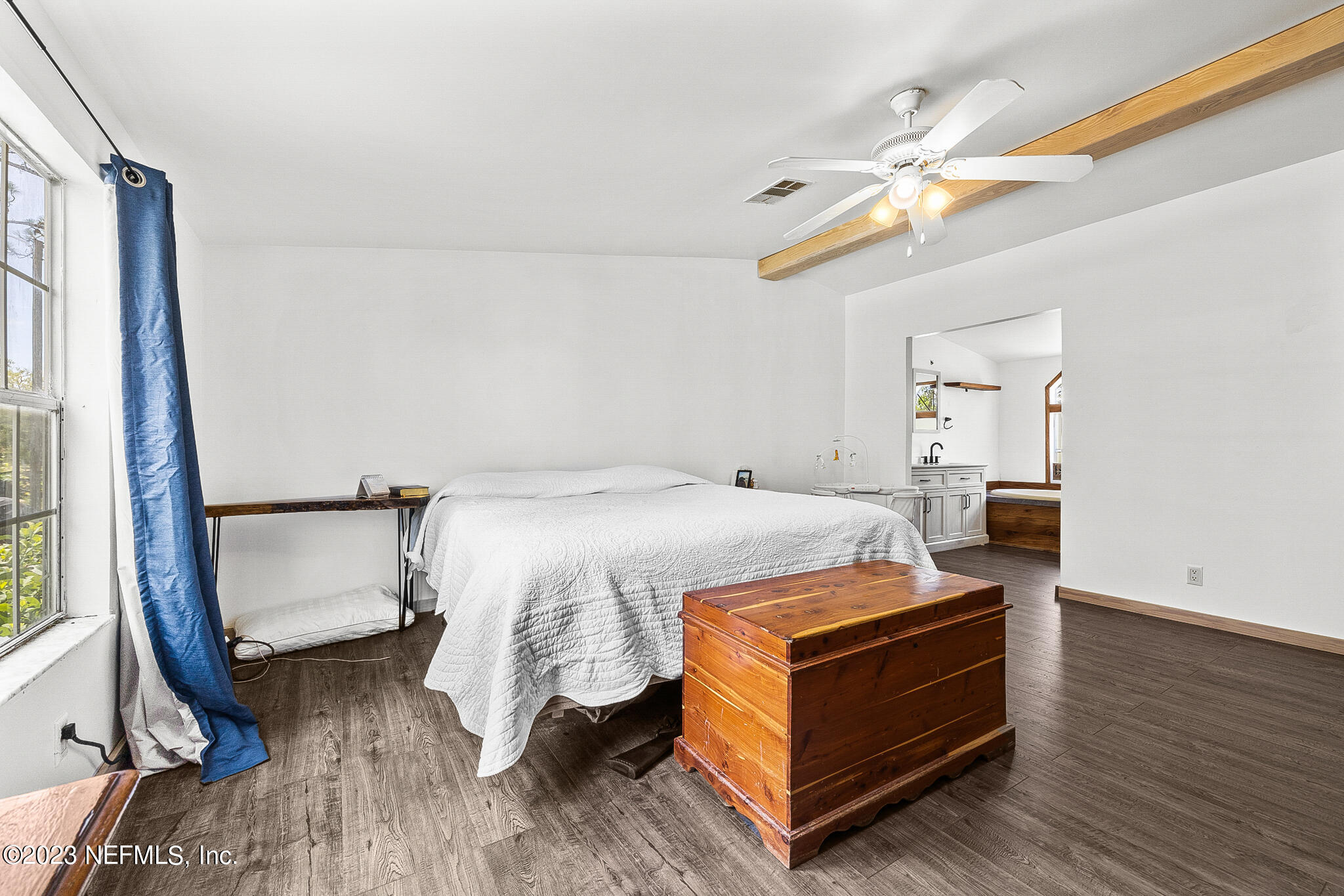 7730 Ranchette Road Keystone Heights, FL 32656 - Photo 11 of 30 a bedroom with a bed and a mirror