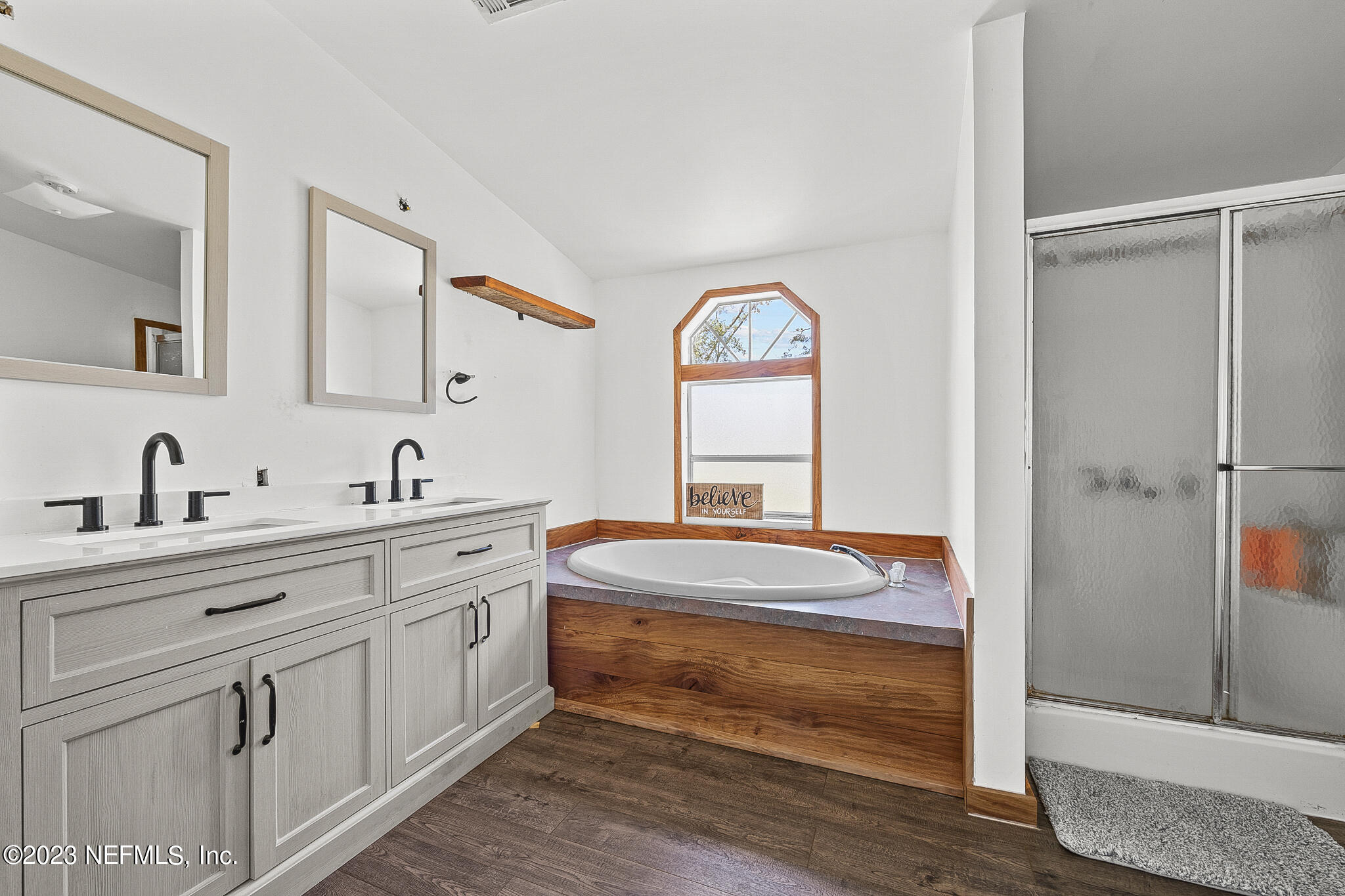 7730 Ranchette Road Keystone Heights, FL 32656 - Photo 12 of 30 a spacious bathroom with a double vanity sink mirror and double