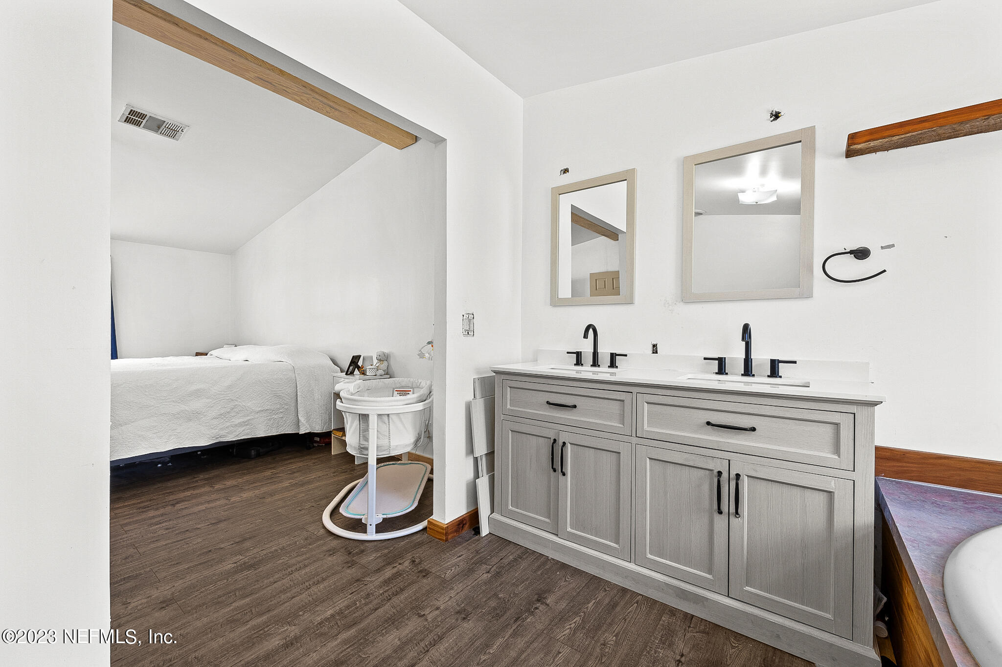 7730 Ranchette Road Keystone Heights, FL 32656 - Photo 13 of 30 a spacious bathroom with a double vanity sink and a mirror