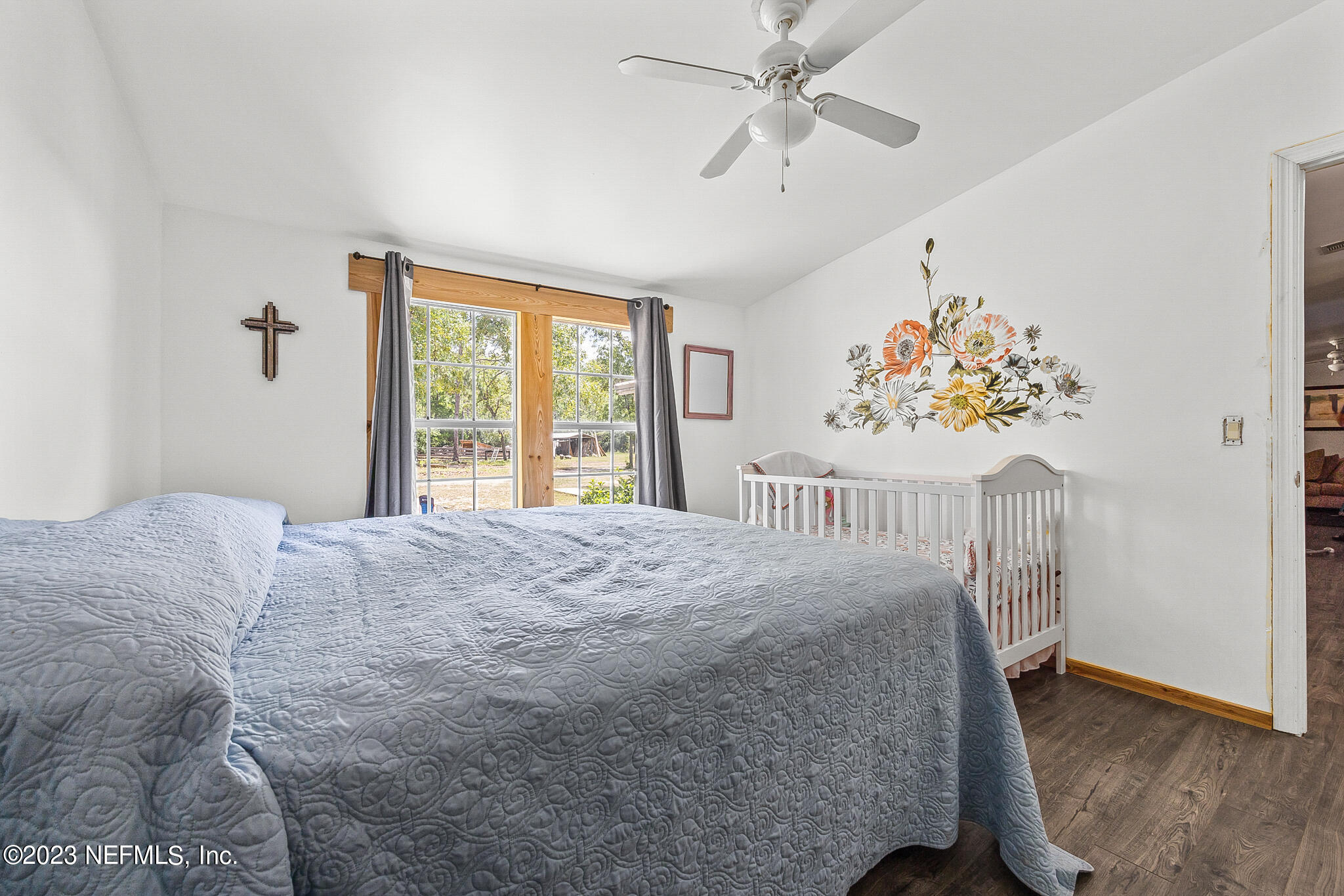 7730 Ranchette Road Keystone Heights, FL 32656 - Photo 15 of 30 a bedroom with a bed and a window