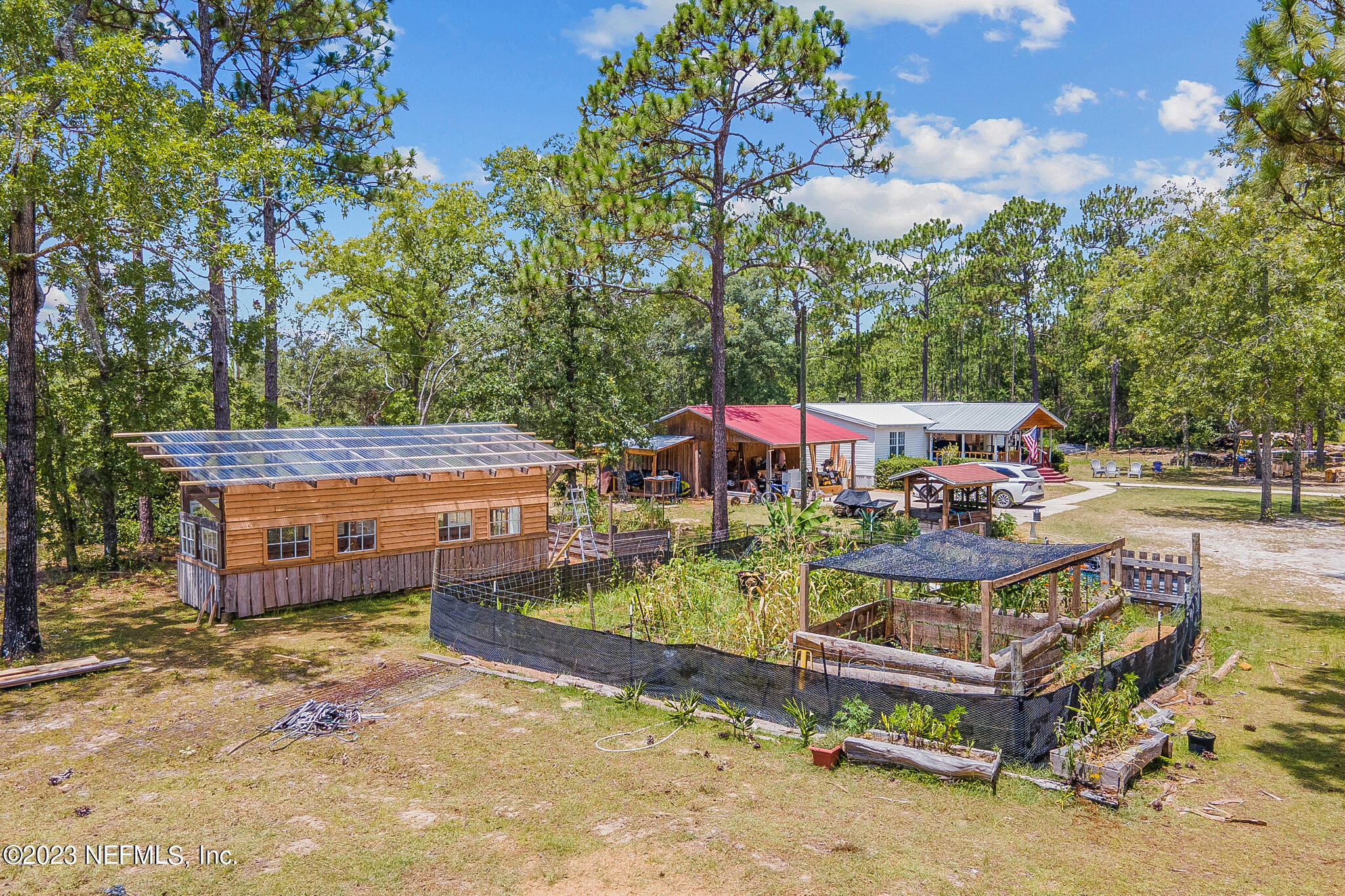 7730 Ranchette Road Keystone Heights, FL 32656 - Photo 23 of 30 an aerial view of a house with swimming pool garden and patio