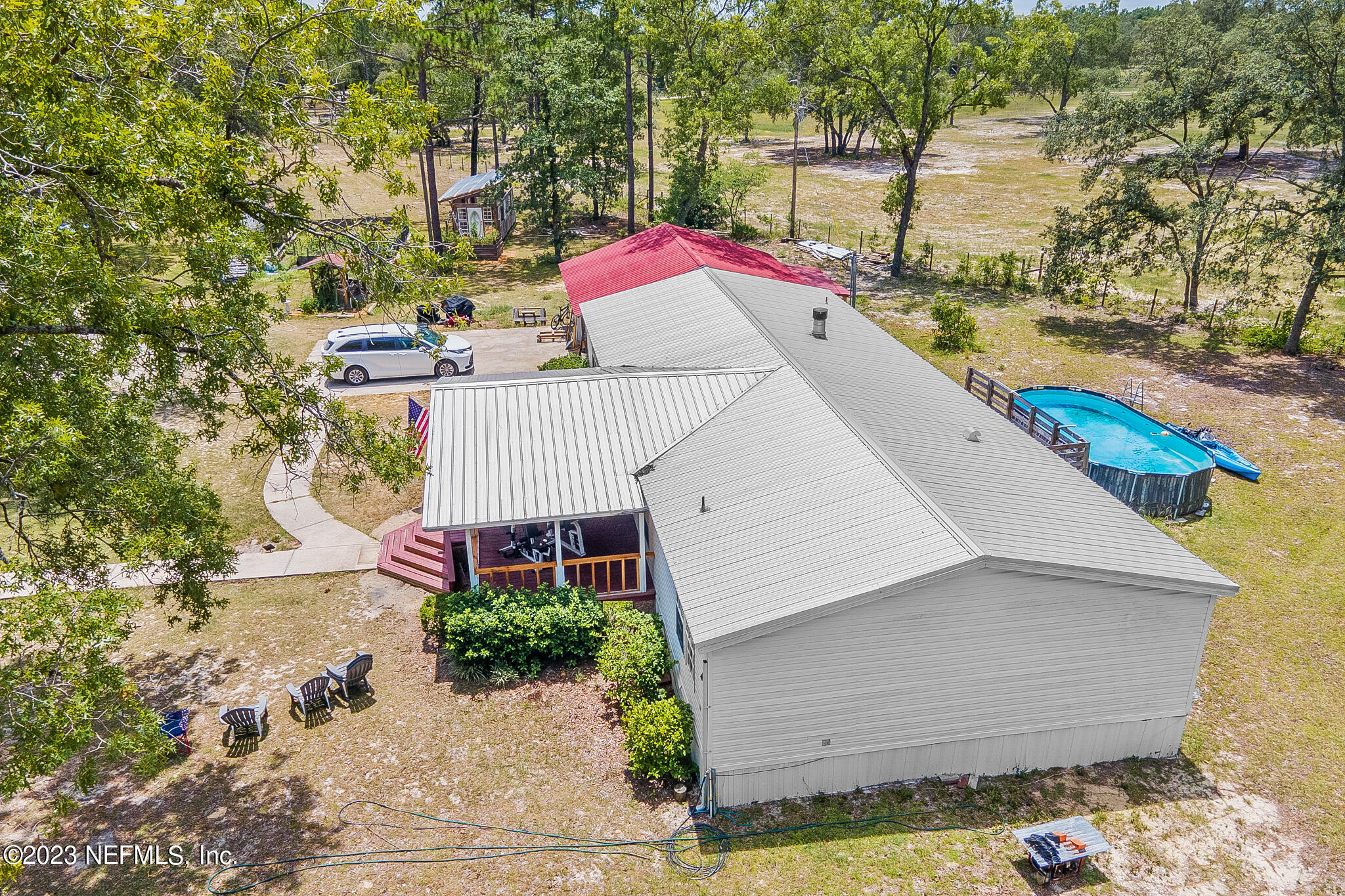 7730 Ranchette Road Keystone Heights, FL 32656 - Photo 25 of 30 a view of a terrace with sitting area