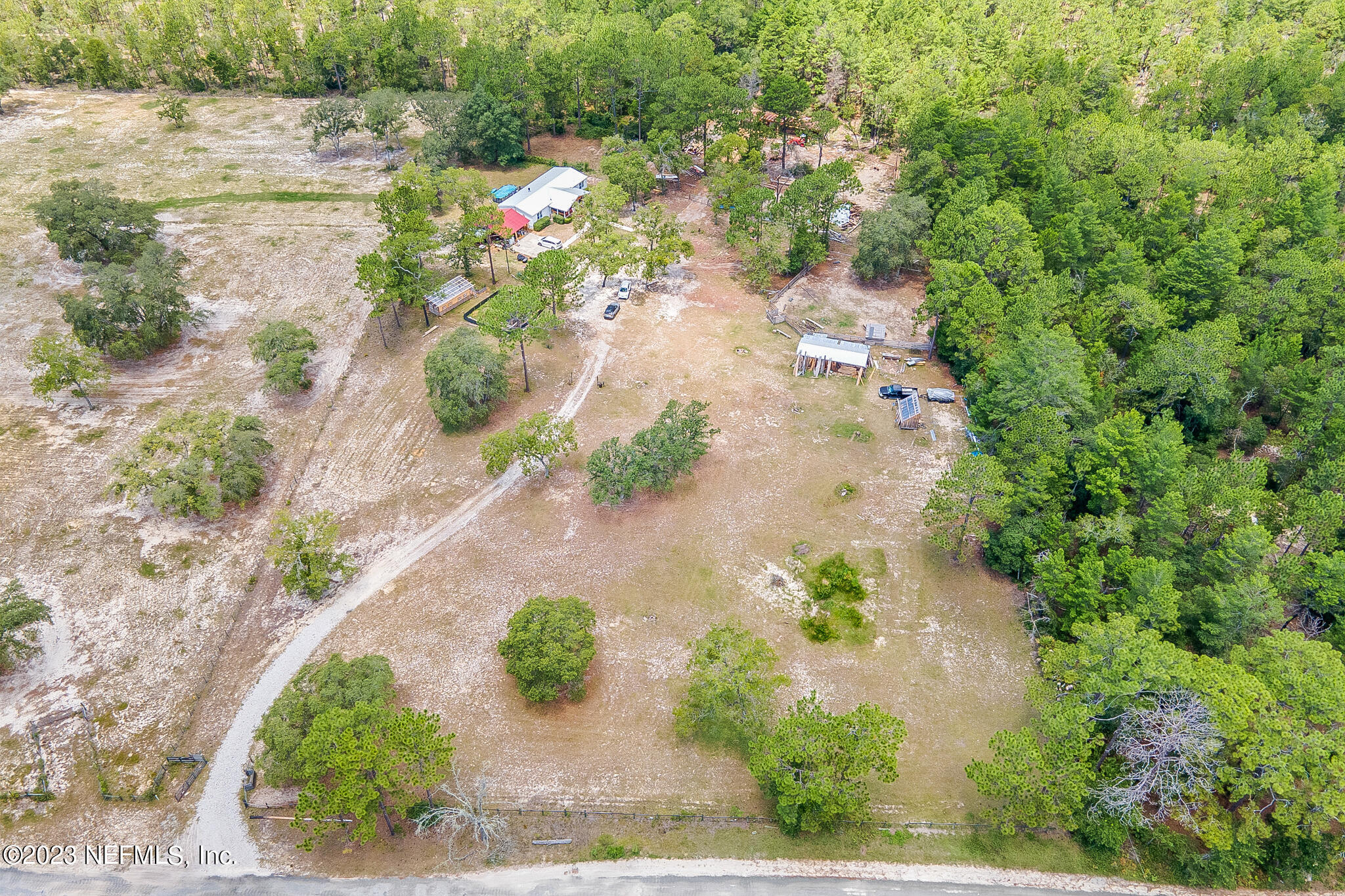 7730 Ranchette Road Keystone Heights, FL 32656 - Photo 27 of 30 a view of a yard with a fountain