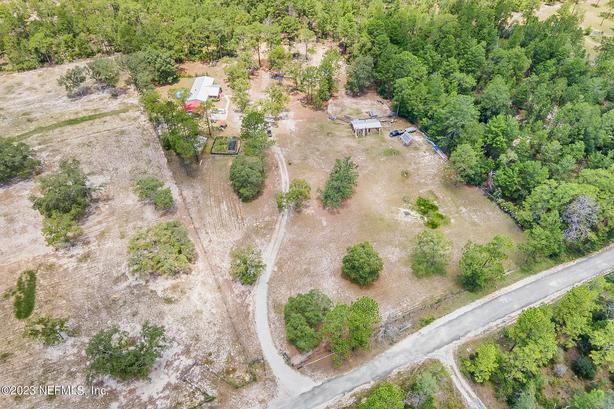 7730 Ranchette Road Keystone Heights, FL 32656 - Photo 28 of 30 an aerial view of a house with a yard and mountain view in back