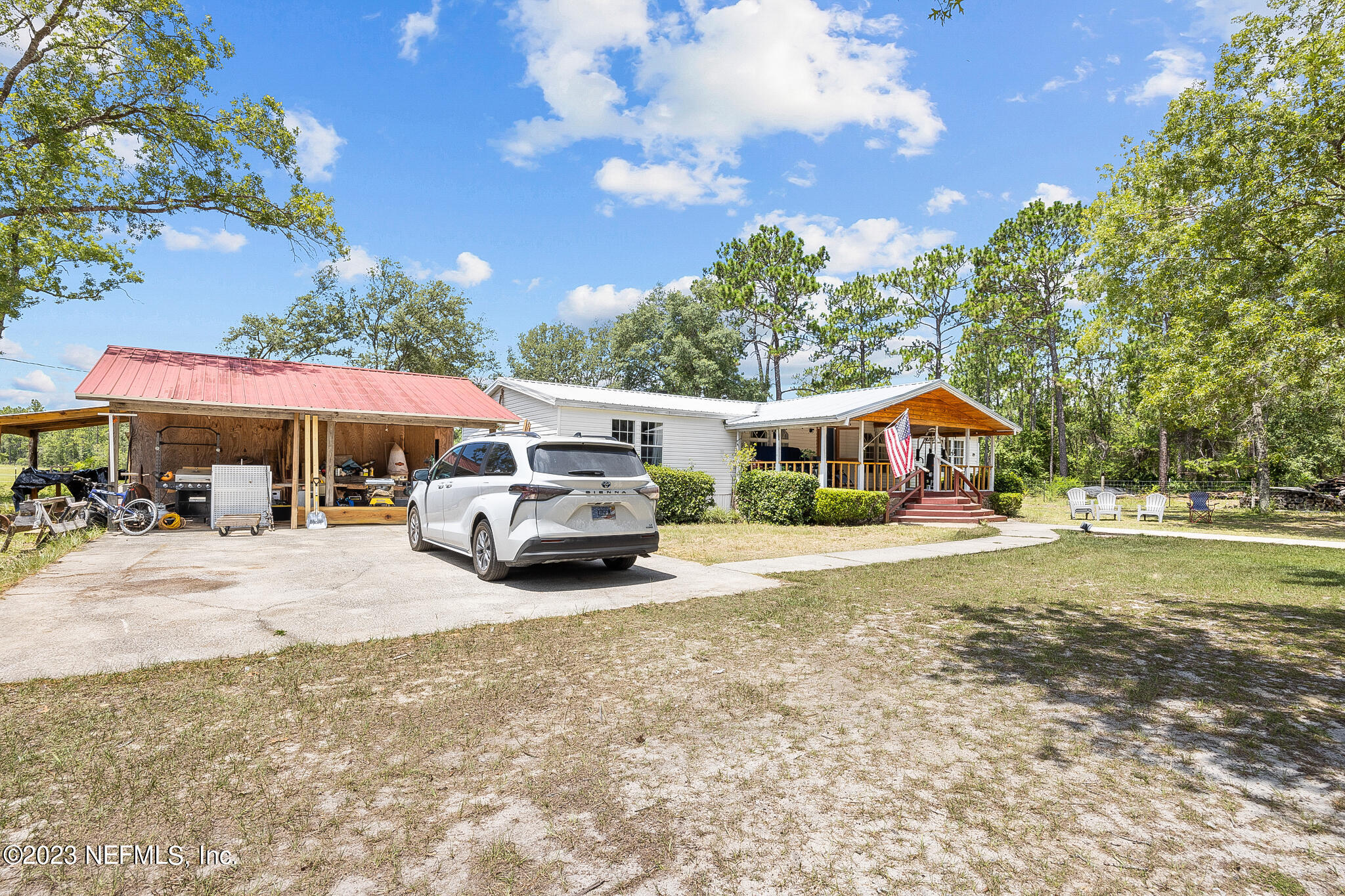 7730 Ranchette Road Keystone Heights, FL 32656 - Photo 3 of 30 a view of house with outdoor space and swimming pool