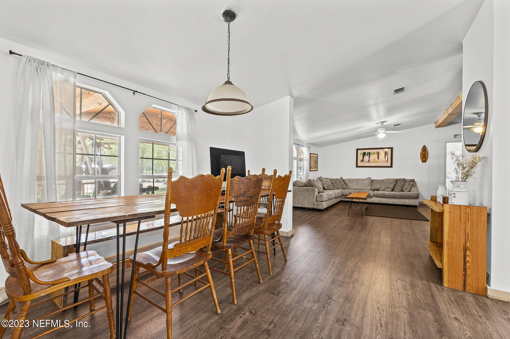 7730 Ranchette Road Keystone Heights, FL 32656 - Photo 9 of 30 a dining room with furniture and wooden floor