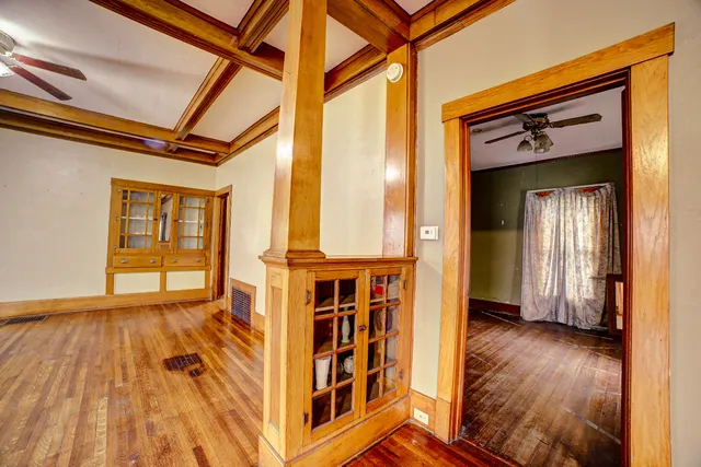 a view of front door with wooden floor and a window