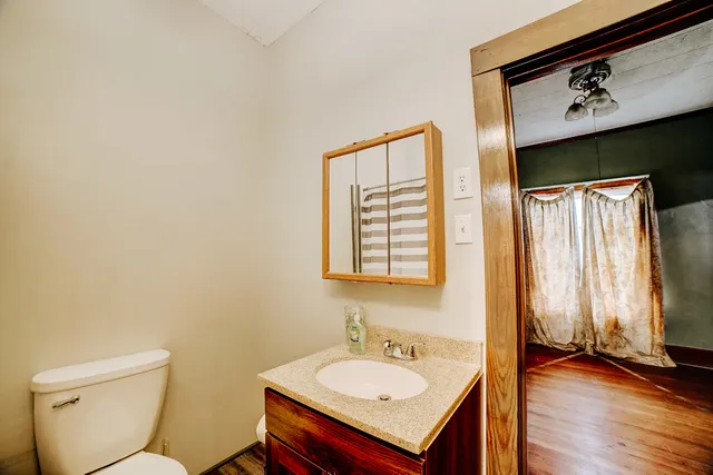a bathroom with a toilet and a sink