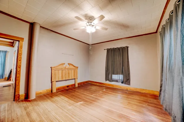 a bedroom with a bed and window