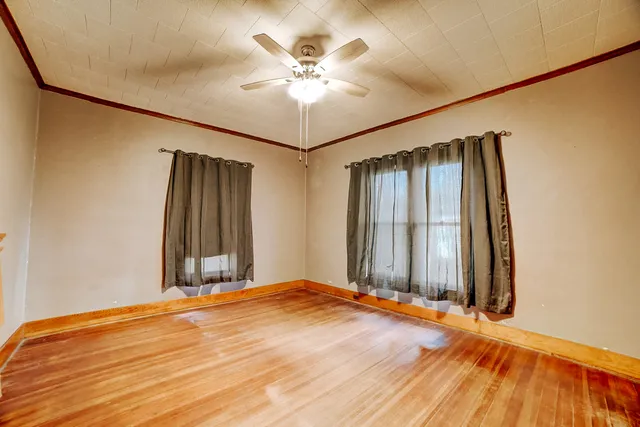 a bedroom with a bed and a night stand