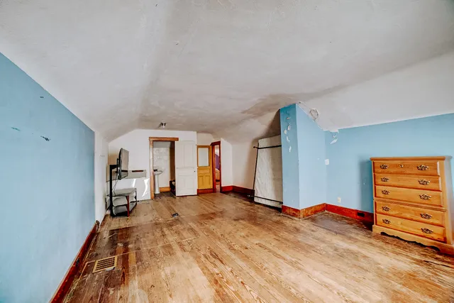 a view of a house with a tree in the background