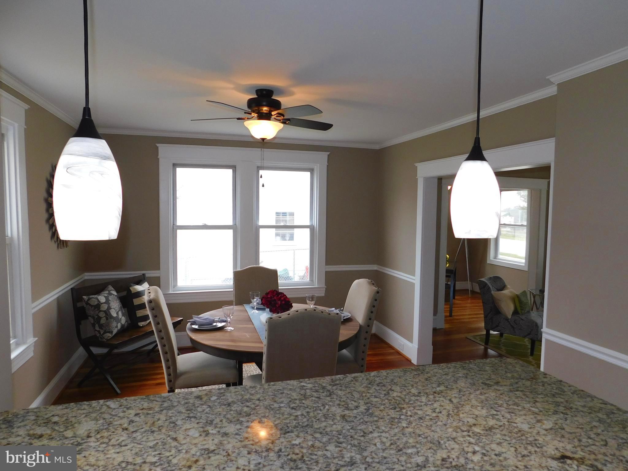 606 Andover Road Linthicum, MD 21090 - Photo 10 of 29 a living room with furniture a window and a chandelier