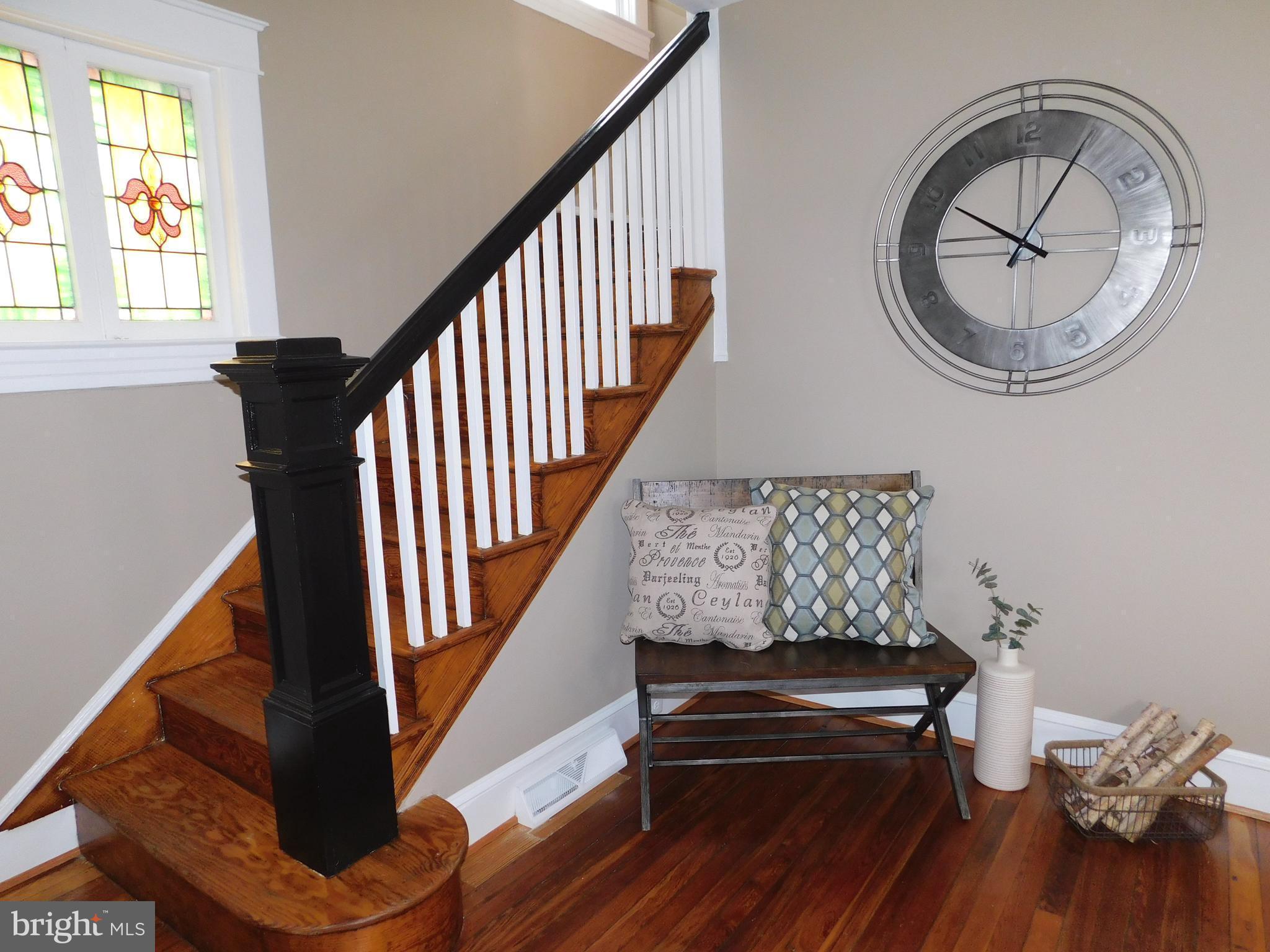 606 Andover Road Linthicum, MD 21090 - Photo 15 of 29 a view of a hallway with wooden floor and windows